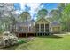 Back deck overlooking a lush lawn and trees at 195 Creekside Way, Mcdonough, GA 30252