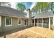 Inviting back porch with wood floors and screened-in area for outdoor living at 195 Creekside Way, Mcdonough, GA 30252