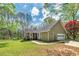 Backyard showcasing a lawn, shed, and mature trees at 195 Creekside Way, Mcdonough, GA 30252