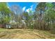 Spacious, well-maintained backyard with a storage shed, offering a serene outdoor setting at 195 Creekside Way, Mcdonough, GA 30252
