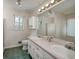 Bathroom featuring double sink vanity, large mirror, and shower/tub combo at 195 Creekside Way, Mcdonough, GA 30252