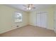 Bedroom with yellow walls, carpet floor, and closet at 195 Creekside Way, Mcdonough, GA 30252