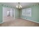 Inviting dining room with carpet, large window, and views to other areas of the home at 195 Creekside Way, Mcdonough, GA 30252