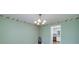 Dining room featuring wallpaper border and view to the kitchen at 195 Creekside Way, Mcdonough, GA 30252