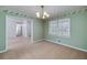 Comfortable dining room with neutral carpet and view of a hallway at 195 Creekside Way, Mcdonough, GA 30252