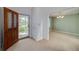 Welcoming entryway with a wooden door and neutral carpet at 195 Creekside Way, Mcdonough, GA 30252
