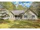 Charming home with stone accents, green shutters, and a welcoming front porch at 195 Creekside Way, Mcdonough, GA 30252