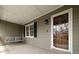 Covered front porch with swing and stylish front door at 195 Creekside Way, Mcdonough, GA 30252