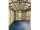 Spacious shed interior with metal frame, insulation, and blue floor at 195 Creekside Way, Mcdonough, GA 30252