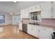 Kitchen with white cabinets, stainless steel appliances, and light pink countertops at 195 Creekside Way, Mcdonough, GA 30252