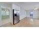 Spacious living room featuring hardwood floors and access to other rooms at 195 Creekside Way, Mcdonough, GA 30252