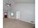 Spacious living room with vaulted ceilings, ceiling fan and view of entryway at 195 Creekside Way, Mcdonough, GA 30252