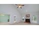 Spacious living room features a brick fireplace, and a vaulted ceiling with ceiling fan at 195 Creekside Way, Mcdonough, GA 30252