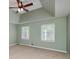 Main bedroom features a vaulted ceiling, carpet, and natural light from multiple windows at 195 Creekside Way, Mcdonough, GA 30252