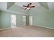 Main bedroom with a vaulted ceiling, ensuite bathroom and large walk-in closet at 195 Creekside Way, Mcdonough, GA 30252