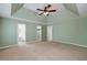Spacious main bedroom with view to the bathroom and closet spaces at 195 Creekside Way, Mcdonough, GA 30252
