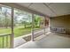 Relax on the porch with a swinging couch at 195 Creekside Way, Mcdonough, GA 30252