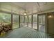 View inside the screened porch featuring a ceiling fan, and an outside view at 195 Creekside Way, Mcdonough, GA 30252