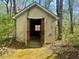 Front view of shed in wooded area at 195 Creekside Way, Mcdonough, GA 30252