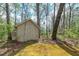 View of shed sitting amongst the trees at 195 Creekside Way, Mcdonough, GA 30252