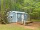 New shed with a small porch in the woods at 195 Creekside Way, Mcdonough, GA 30252