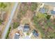 An aerial view of a home and neighborhood showcasing the surrounding landscape and street layout at 802 Towering Pine Trl, Lawrenceville, GA 30045