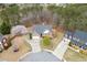 Overhead view of real estate displaying a manicured front yard, driveway, mature landscaping, and well-maintained homes at 802 Towering Pine Trl, Lawrenceville, GA 30045