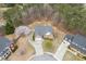 Overhead shot of a well-maintained home with landscaping, a driveway, and a spacious yard at 802 Towering Pine Trl, Lawrenceville, GA 30045