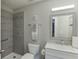 Modern bathroom features a tiled shower, white toilet, vanity, and stylish fixtures, offering a clean aesthetic at 802 Towering Pine Trl, Lawrenceville, GA 30045