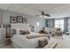 Cozy bedroom with a large bed, seating area, and soft natural light at 802 Towering Pine Trl, Lawrenceville, GA 30045