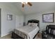 Charming bedroom showcases a vaulted ceiling, cozy king-sized bed, and decor art, ideal for relaxation at 802 Towering Pine Trl, Lawrenceville, GA 30045
