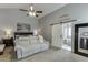 Inviting bedroom with a comfy sofa, barn door to the ensuite, and a serene ambiance, ideal for relaxation at 802 Towering Pine Trl, Lawrenceville, GA 30045