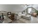 Cozy bonus room featuring a comfortable sectional sofa, desk, and carpet flooring at 802 Towering Pine Trl, Lawrenceville, GA 30045