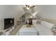 A bright bonus room featuring a comfortable sofa, media center, and carpeted floor at 802 Towering Pine Trl, Lawrenceville, GA 30045