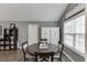 Charming dining area with modern table and chairs, built-in cabinets, and natural light at 802 Towering Pine Trl, Lawrenceville, GA 30045