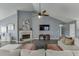 Living room with a fireplace, vaulted ceiling and neutral tones at 802 Towering Pine Trl, Lawrenceville, GA 30045