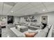 Comfortable living room with a sectional sofa, decorative pillows, and modern decor at 802 Towering Pine Trl, Lawrenceville, GA 30045