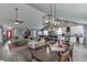 Open concept living space seamlessly integrates the living room, dining area, and modern kitchen at 802 Towering Pine Trl, Lawrenceville, GA 30045