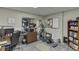 Functional office space with a desk, printer, exercise bike, and ample storage at 802 Towering Pine Trl, Lawrenceville, GA 30045