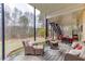 Inviting outdoor patio area with comfortable seating, a fire pit, and a view of the backyard at 802 Towering Pine Trl, Lawrenceville, GA 30045