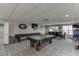 Large recreation room with a pool table, dining set, and Georgia Bulldogs decor at 802 Towering Pine Trl, Lawrenceville, GA 30045