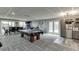 Spacious recreation room with a pool table, dining area, and stainless steel refrigerator at 802 Towering Pine Trl, Lawrenceville, GA 30045