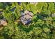 Aerial view of the home featuring mature trees and landscaping providing a private and serene setting at 1483 Jones Rd, Roswell, GA 30075