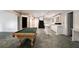 Spacious basement with a pool table and bar area perfect for entertaining at 1483 Jones Rd, Roswell, GA 30075