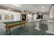 Finished basement with a pool table and bar at 1483 Jones Rd, Roswell, GA 30075