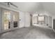 Bonus room features french doors, carpet, and large open space at 1483 Jones Rd, Roswell, GA 30075