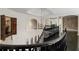 Hallway with black railings, arched windows, a chandelier, and decorative features at 1483 Jones Rd, Roswell, GA 30075
