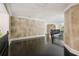 Hallway with hardwood floors and elegant neutral colored walls with decorative trim at 1483 Jones Rd, Roswell, GA 30075