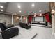 Home theater room featuring reclining chairs, sconces, red curtains, and a large screen at 1483 Jones Rd, Roswell, GA 30075