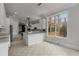 Bright kitchen featuring white cabinets, stainless steel appliances, and a large window at 1483 Jones Rd, Roswell, GA 30075